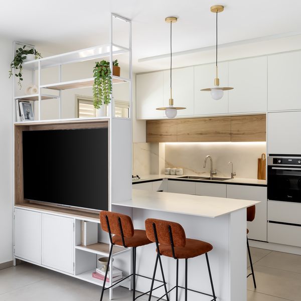 Open-plan kitchen and TV unit designed by TwoDesign